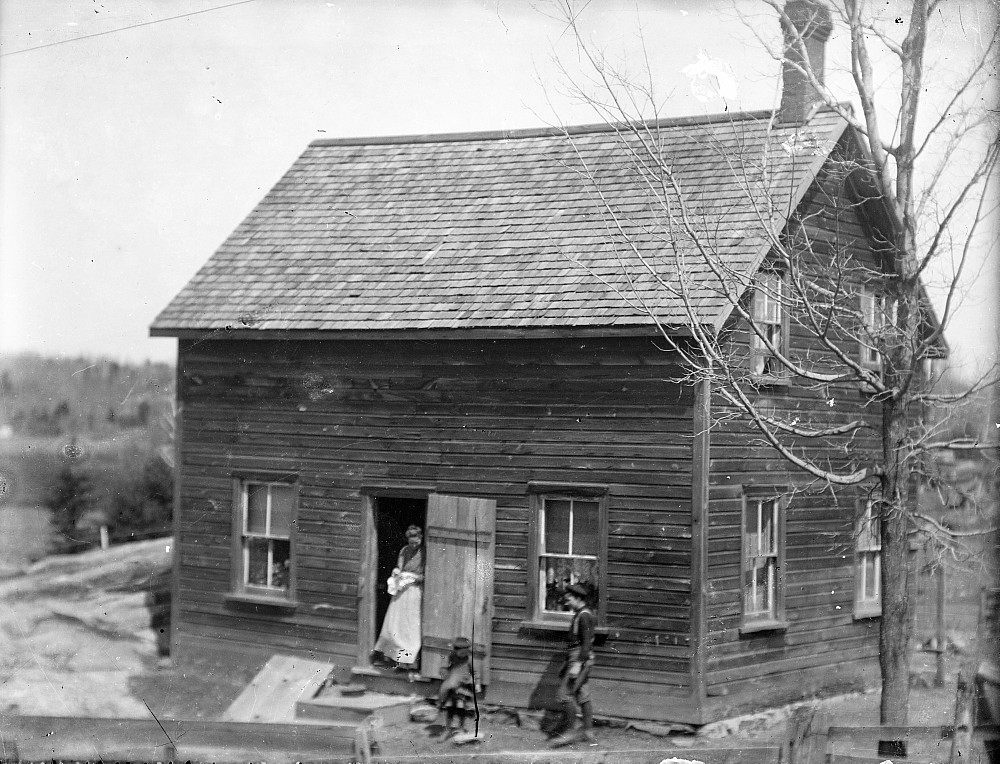 House with woman in door, c.1900