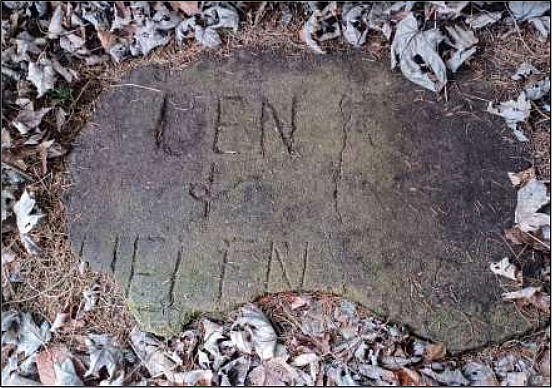 Flagstone inscribed 'Ken and Helen'.