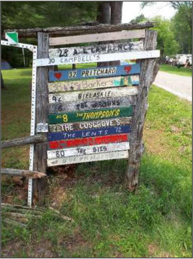 Sleepy Hollow road sign with stuffed doll on it