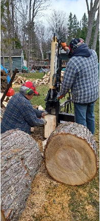 cutting and splitting a maple log