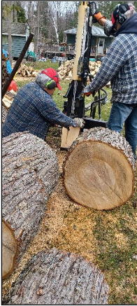 cutting and splitting a maple log