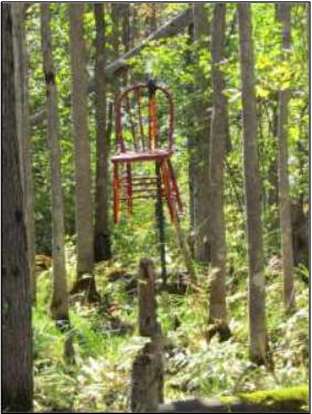 Old red chair marking the corner of the lot.