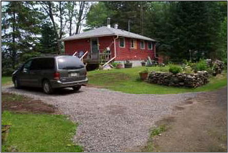 Car - cottage - gravelled driveway.