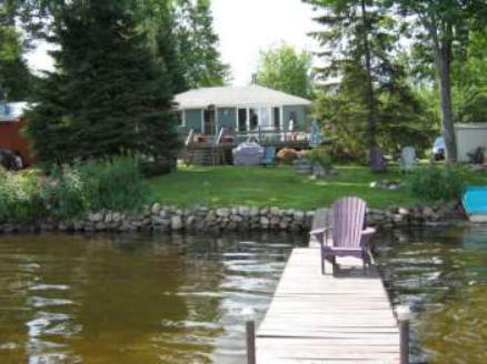 cottage and lawn shown from end of the dock