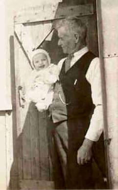 Dimitri Chalykoff, holding his eldest grandson, Ted, 1936, Val D'Or.