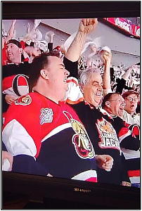 Ernie Bies wearing a Hearst Lumberjacks hockey sweater at an Ottawa Senators game