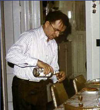 father pouring slivovice