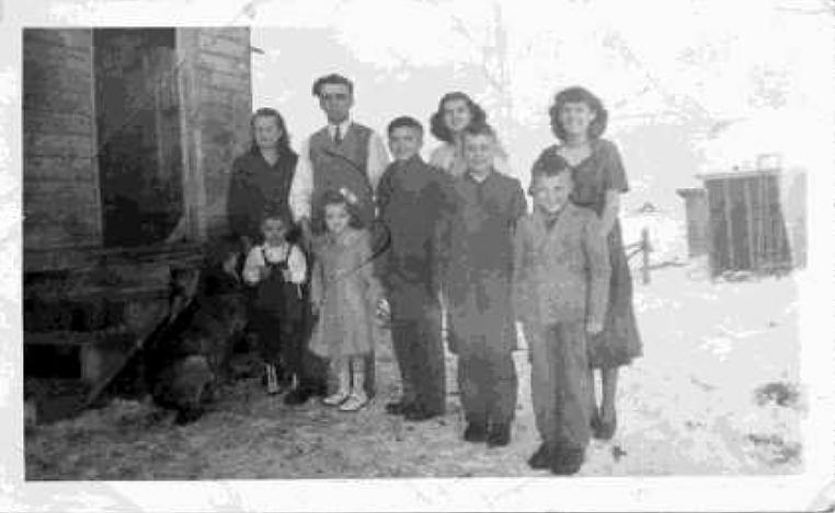 family group of nine people outside in winter