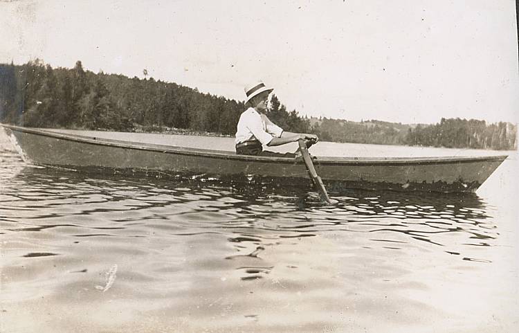 unknown person rowing a boat