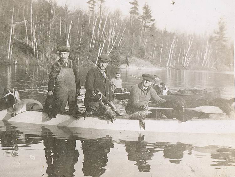 deer hunters in boats