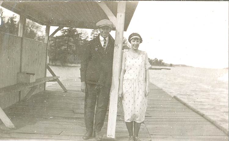 couple standing on a dock